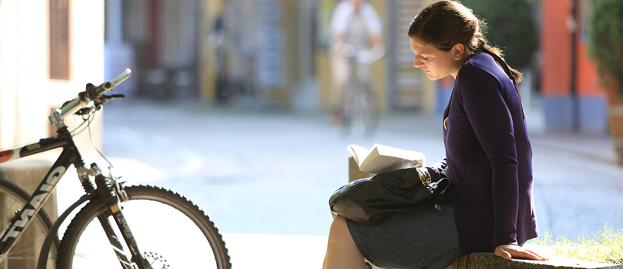 Woman Reading a Book (© Harry Schiffer)